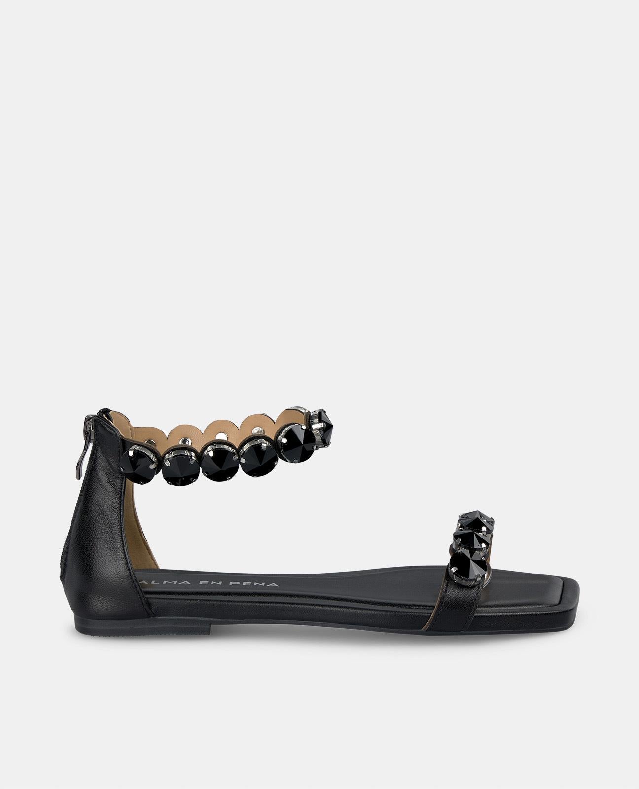 alma-en-pena-flat-sandal-straps-detail-flache-sandale-schwarz image 1